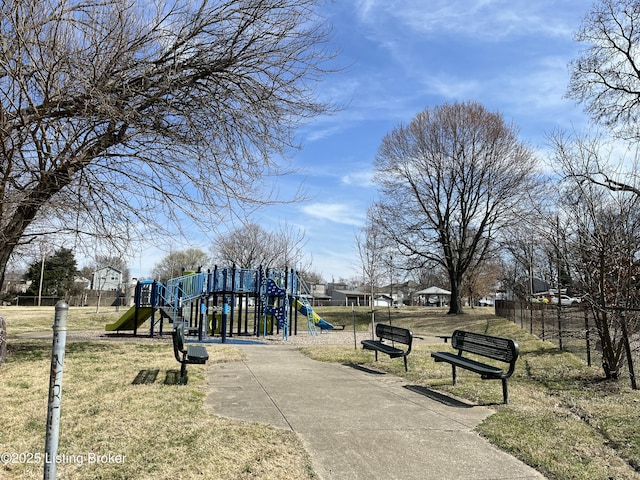 community jungle gym with a yard