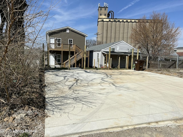 view of front of home featuring stairway