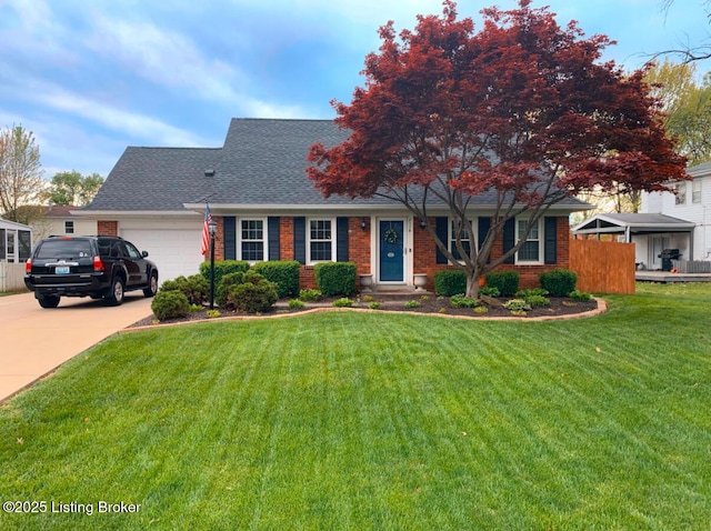 view of front facade featuring a front yard and a garage