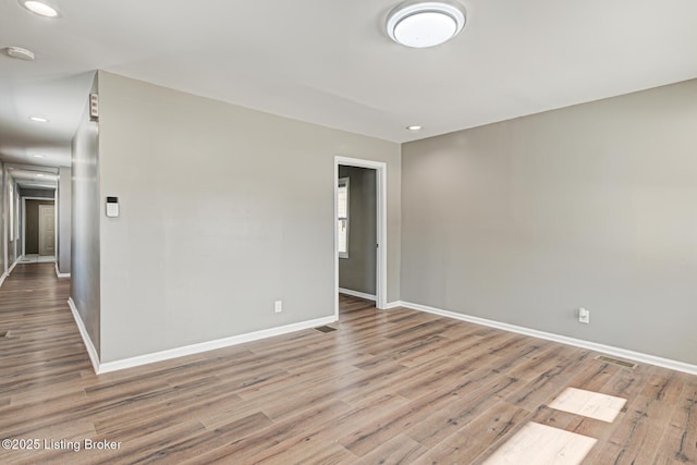 spare room featuring light hardwood / wood-style floors