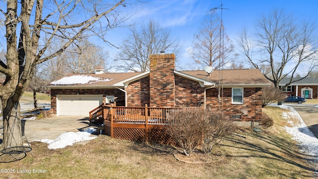 view of side of property featuring a lawn, a deck, and a garage