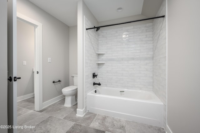 bathroom with tub / shower combination and toilet