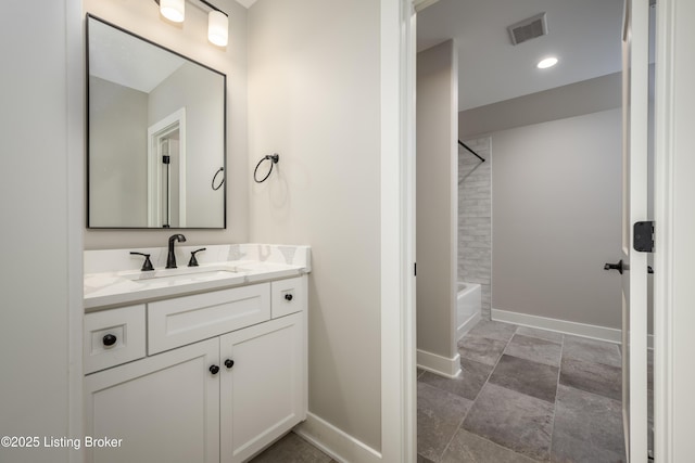 bathroom featuring vanity and tiled shower / bath combo