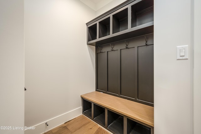 mudroom with wood-type flooring