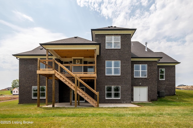 rear view of house featuring central AC unit, a yard, a patio, and a wooden deck