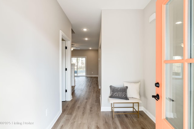 corridor with light hardwood / wood-style flooring