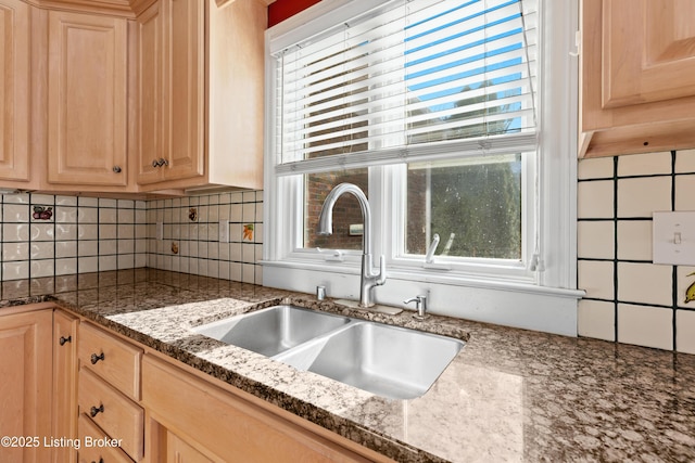 kitchen featuring light brown cabinetry, plenty of natural light, and sink