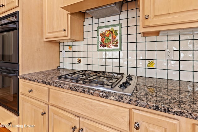 kitchen with light brown cabinetry, tasteful backsplash, stainless steel gas cooktop, and range hood