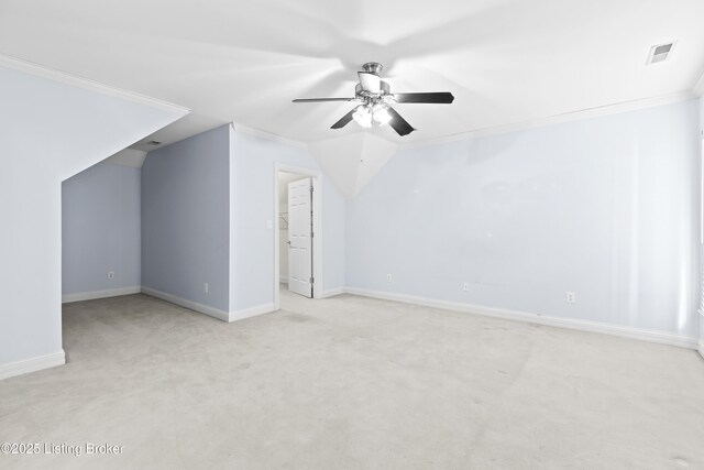 additional living space featuring ceiling fan, lofted ceiling, and light carpet