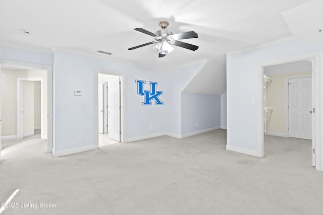 additional living space featuring ceiling fan and light colored carpet