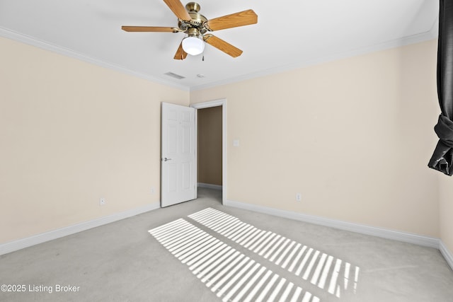 unfurnished bedroom featuring ceiling fan, light colored carpet, and ornamental molding