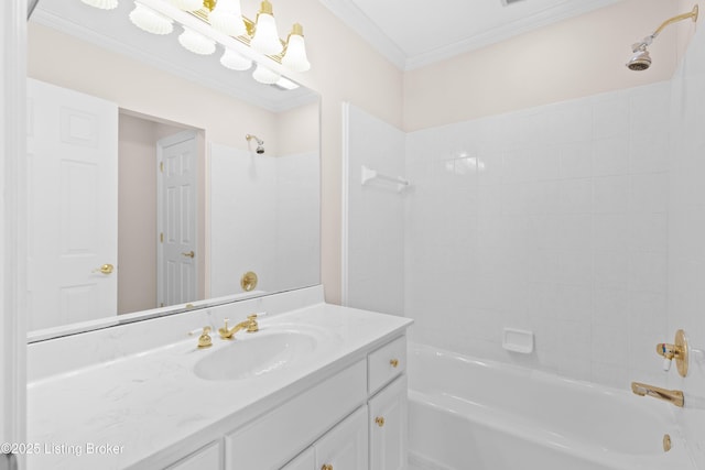 bathroom with vanity, ornamental molding, and shower / washtub combination