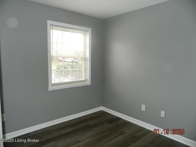 empty room featuring dark hardwood / wood-style floors