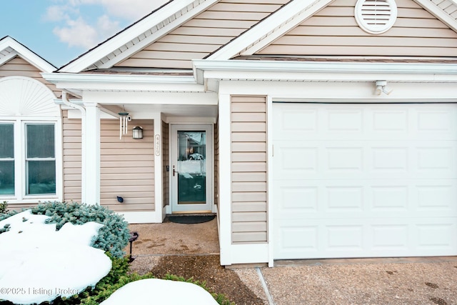 doorway to property featuring a garage