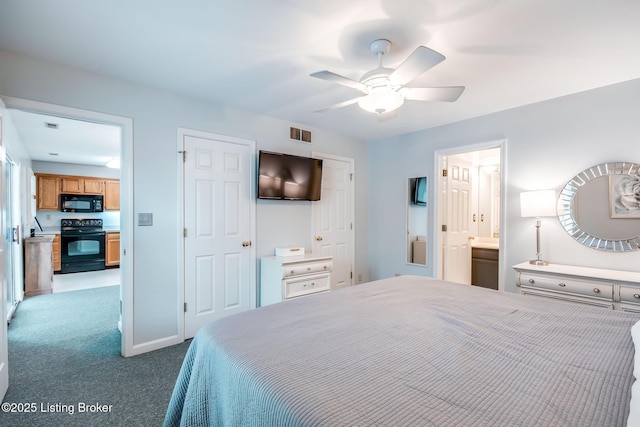 carpeted bedroom with ensuite bathroom and ceiling fan