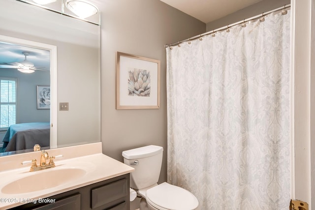 bathroom featuring ceiling fan, vanity, and toilet