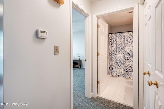 hallway featuring carpet