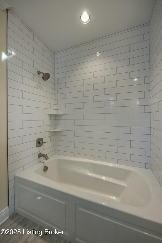 full bath with tub / shower combination and wood finished floors