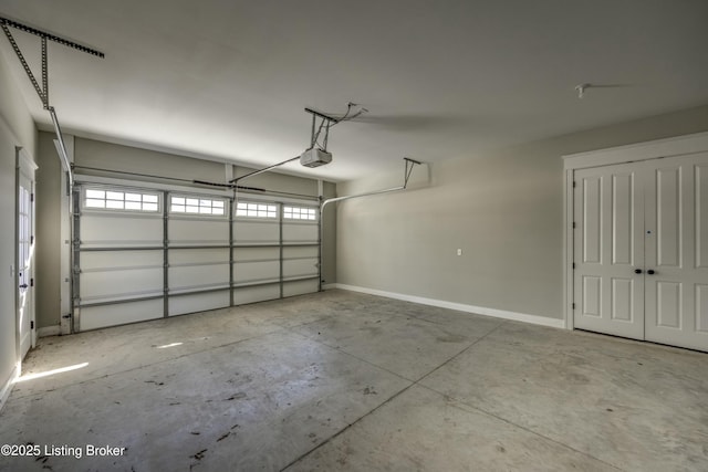 garage featuring baseboards and a garage door opener