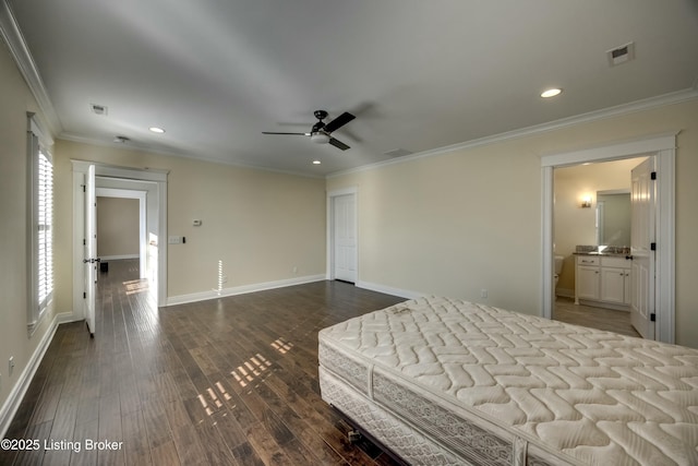 unfurnished bedroom featuring dark wood finished floors, visible vents, and crown molding