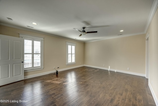 unfurnished room featuring baseboards, visible vents, dark wood finished floors, and crown molding