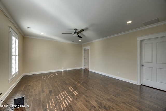 unfurnished room with baseboards, visible vents, dark wood-style flooring, and ornamental molding