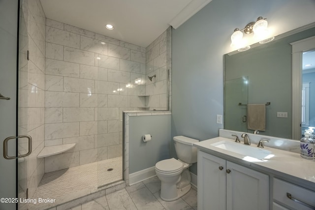 full bathroom with marble finish floor, a tile shower, vanity, and toilet