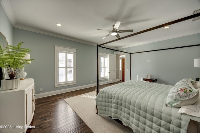 bedroom featuring ceiling fan, recessed lighting, dark wood-type flooring, baseboards, and crown molding