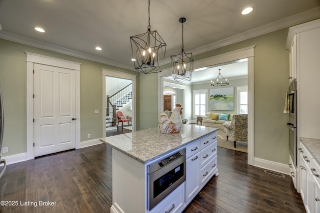 kitchen featuring white cabinets and dark wood-type flooring