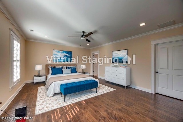 bedroom with baseboards, visible vents, ornamental molding, and wood finished floors