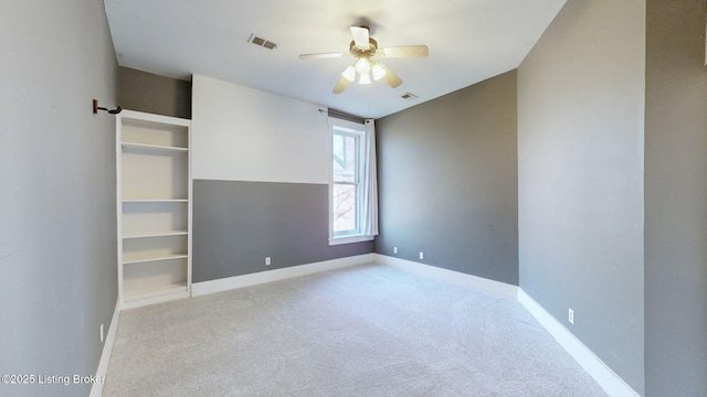 unfurnished bedroom featuring ceiling fan and light carpet