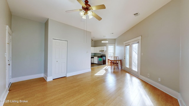 unfurnished living room with ceiling fan and light hardwood / wood-style floors