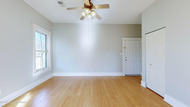 spare room featuring ceiling fan and light wood-type flooring