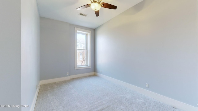 carpeted empty room with ceiling fan and lofted ceiling