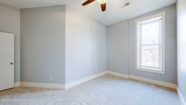 carpeted empty room with ceiling fan