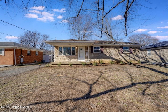 single story home featuring covered porch