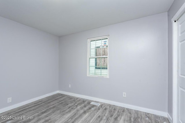 spare room featuring light hardwood / wood-style flooring