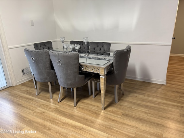 dining space featuring light hardwood / wood-style flooring