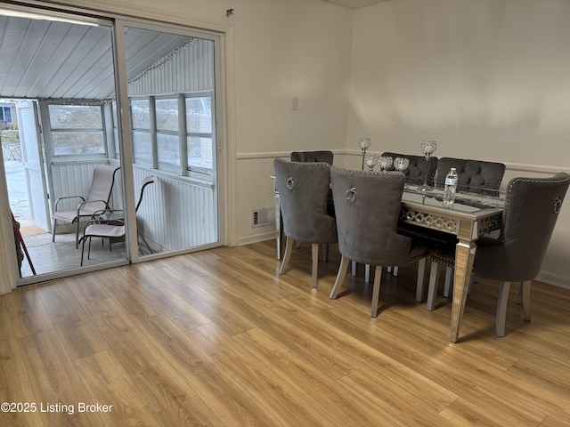 dining area with light wood-type flooring