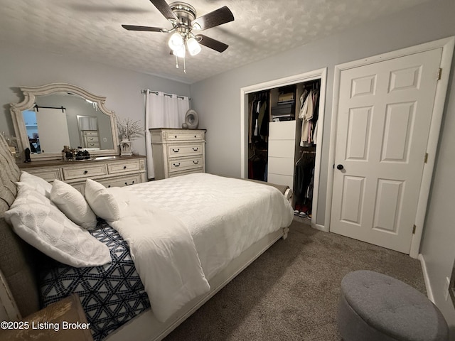 carpeted bedroom with a textured ceiling, ceiling fan, and a closet