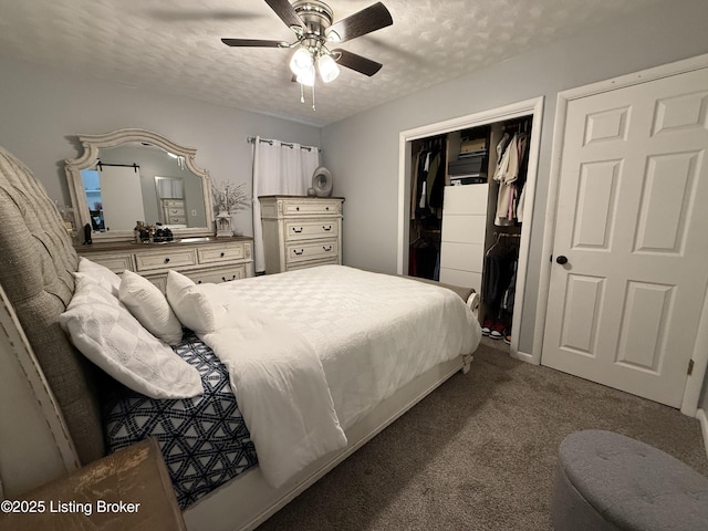 carpeted bedroom with a textured ceiling, ceiling fan, and a closet