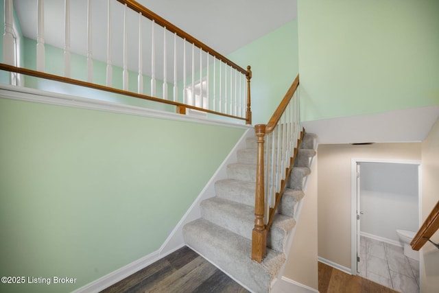8923 La Costa Rd, Jeffersontown, KY 40299 - stairway with baseboards and wood finished floors