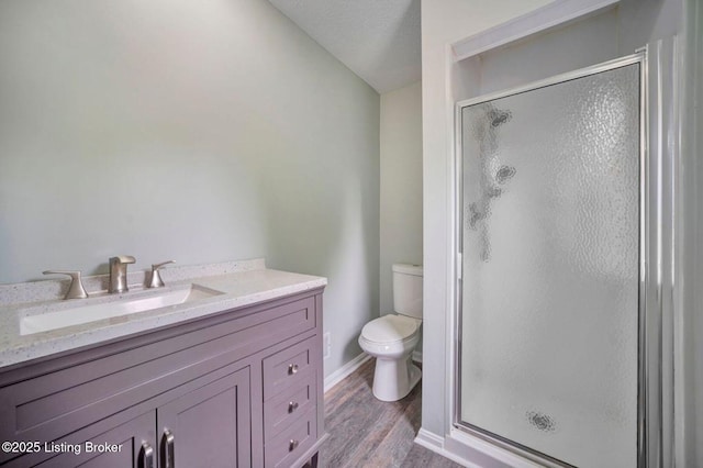 8923 La Costa Rd, Jeffersontown, KY 40299 - full bathroom featuring toilet, a shower stall, wood finished floors, and vanity