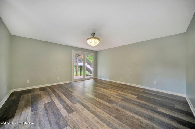 8923 La Costa Rd, Jeffersontown, KY 40299 - spare room with wood finished floors, baseboards, and a chandelier