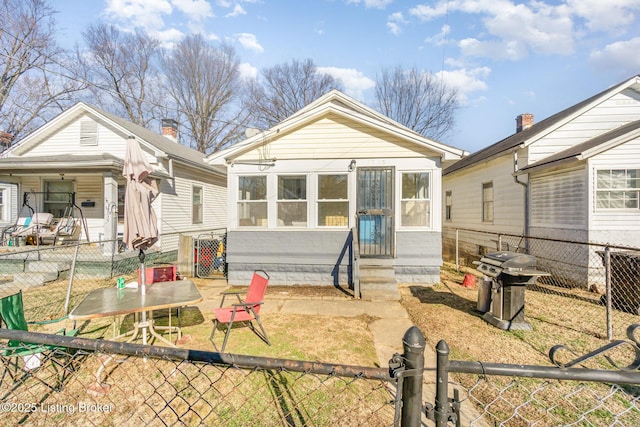 rear view of property featuring central AC