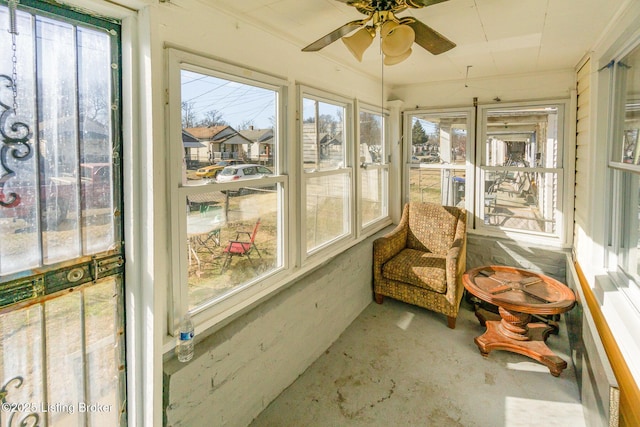 sunroom / solarium with ceiling fan