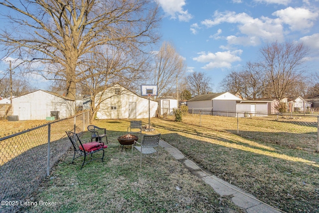 view of yard featuring an outdoor fire pit