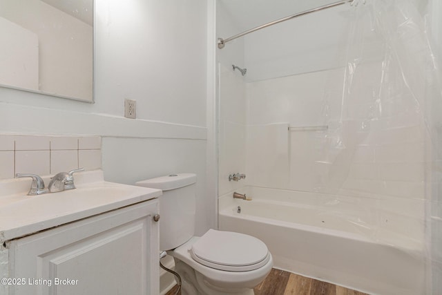 full bathroom featuring hardwood / wood-style flooring, vanity, decorative backsplash, toilet, and shower / bath combo with shower curtain