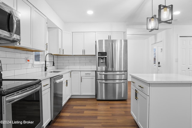 kitchen with sink, stainless steel appliances, and white cabinetry