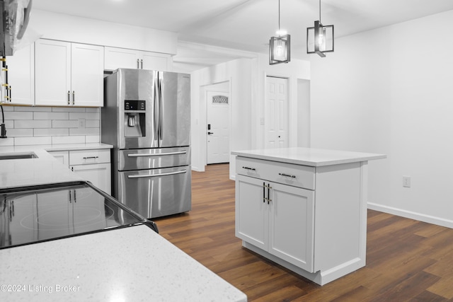 kitchen featuring white cabinetry, stainless steel refrigerator with ice dispenser, decorative backsplash, dark wood-type flooring, and range